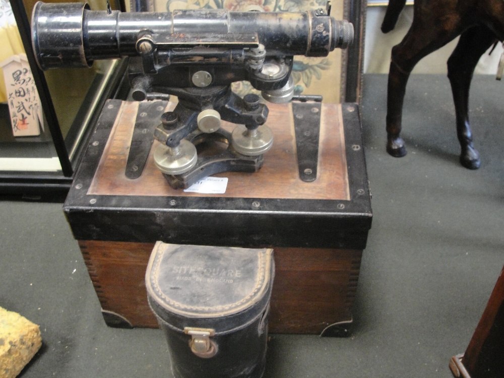 A cased theodolite and stand, c1950