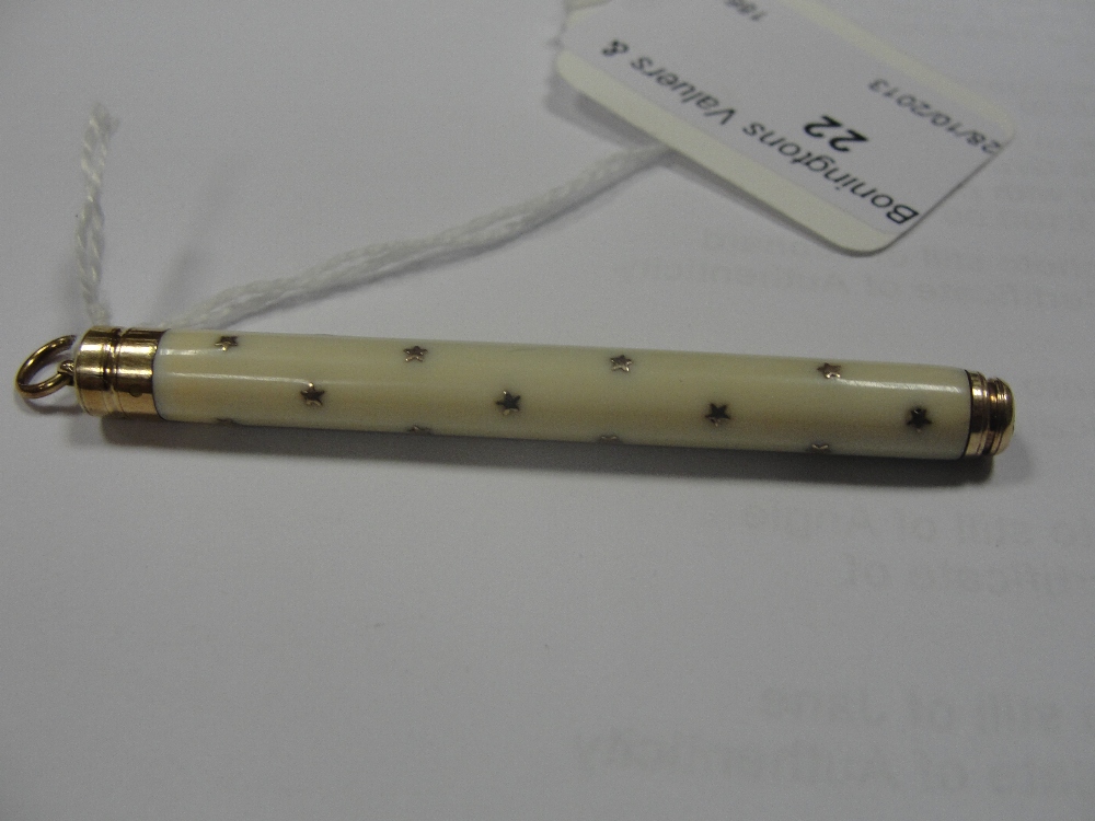 A gold and ivory propelling pencil