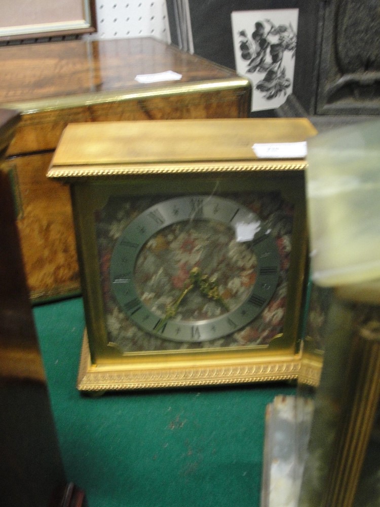 A Luxor mantel clock with embroidered dial