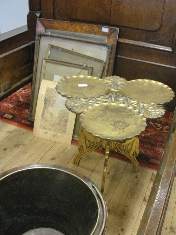 A 19th century gilded cake table with leaf decoration