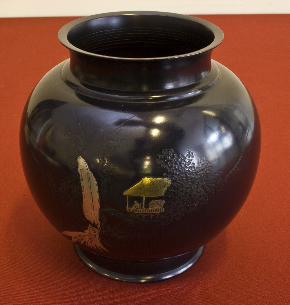 A 19th century Japanese bronze vase with gold and silver decoration. Signed. 19cm tall