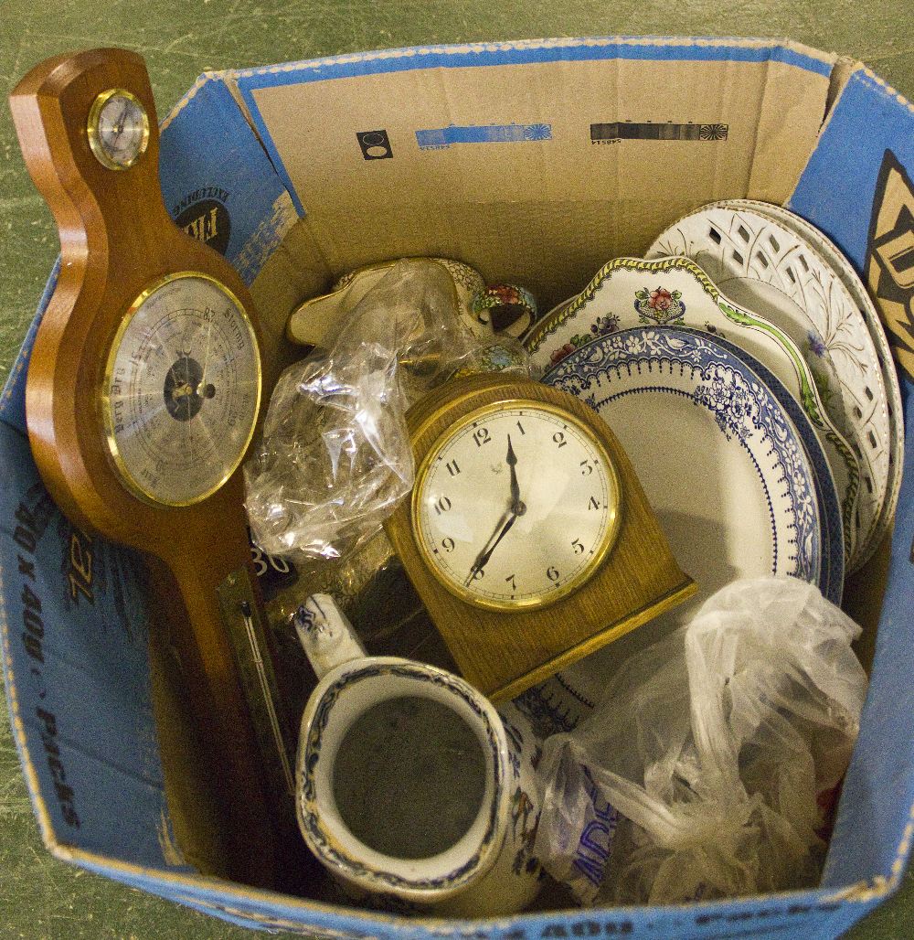 A box of assorted items including a barometer, clock, teapot, cream, jug and assorted plates