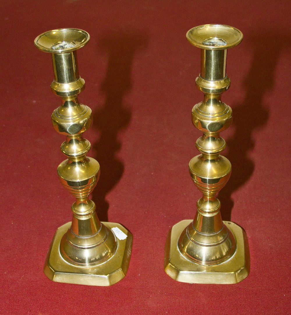 A pair of brass candlesticks