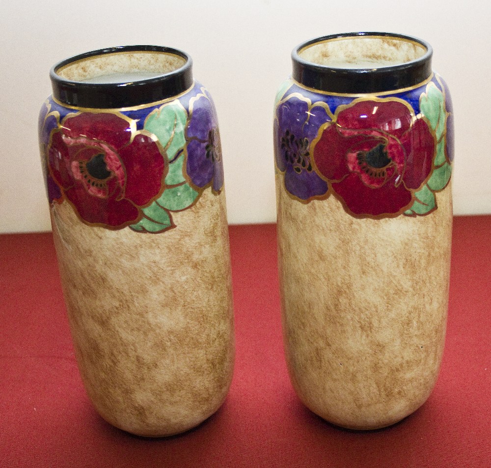 A pair of Regal Ware vases, poppy design. 23cm high