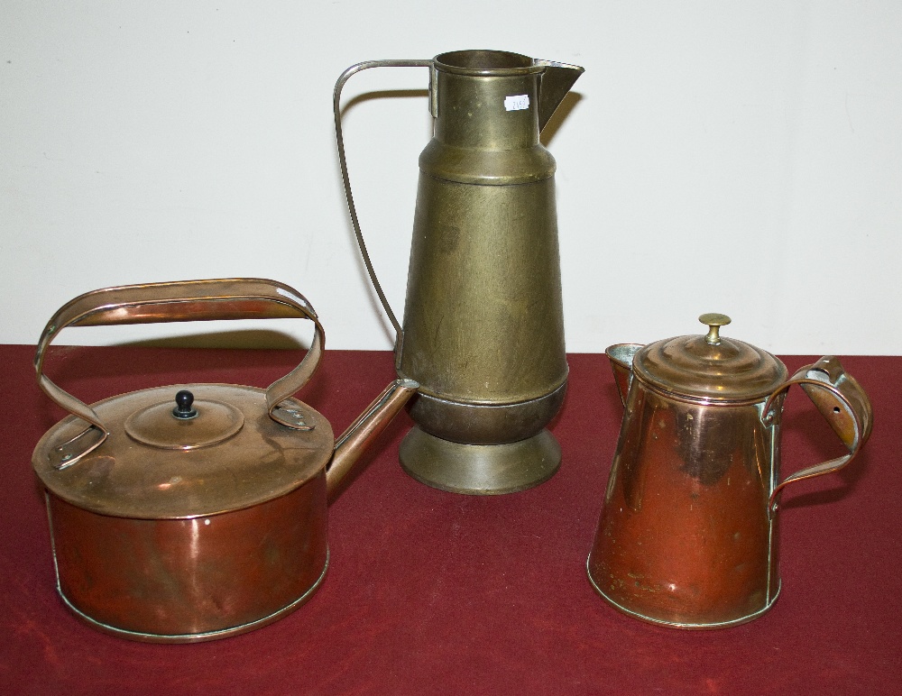 A copper kettle, copper lidded jug and a brass ewer