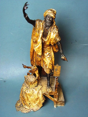 A large figure of a Persian beggar on a raised platform base, 24" high.