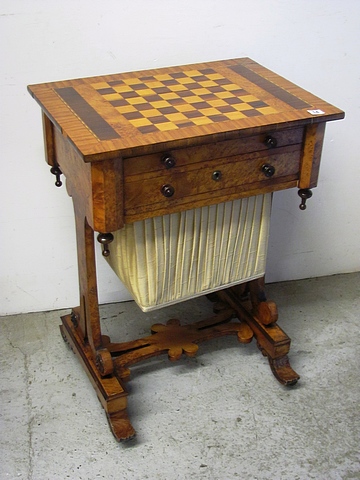 A 19th century burr walnut and marquetry inlaid games and sewing table.