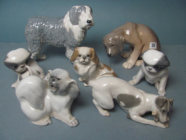 A group of Royal Copenhagen dog figurines to include an Old English Sheepdog (7).