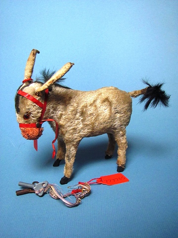 A mid 20th century continental mechanical donkey toy, 5" long.