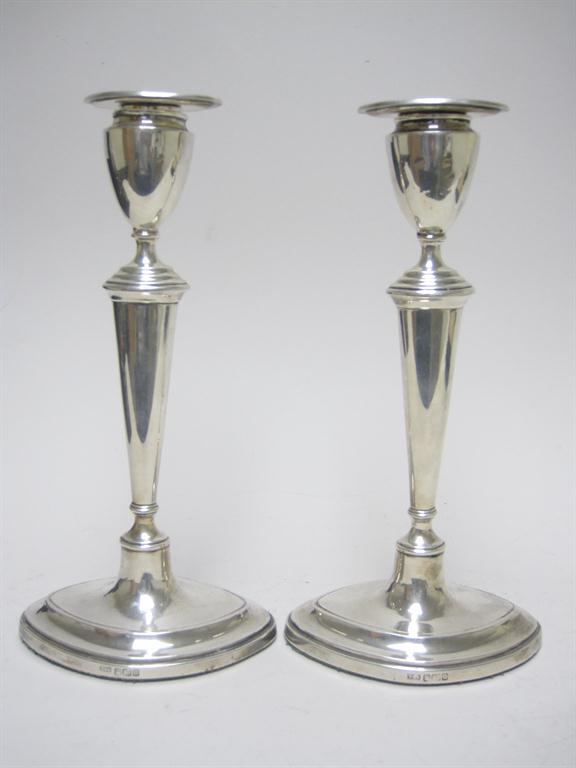 Pair of Edward VII Pillar Candlesticks with tapering columns on oval bases, Sheffield 1906, 9 1/4in