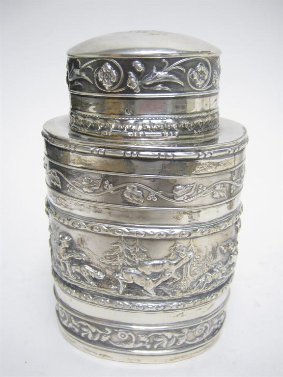 A Continental silver oval Tea Caddy and Cover finely embossed stag hunting scene, import mark London