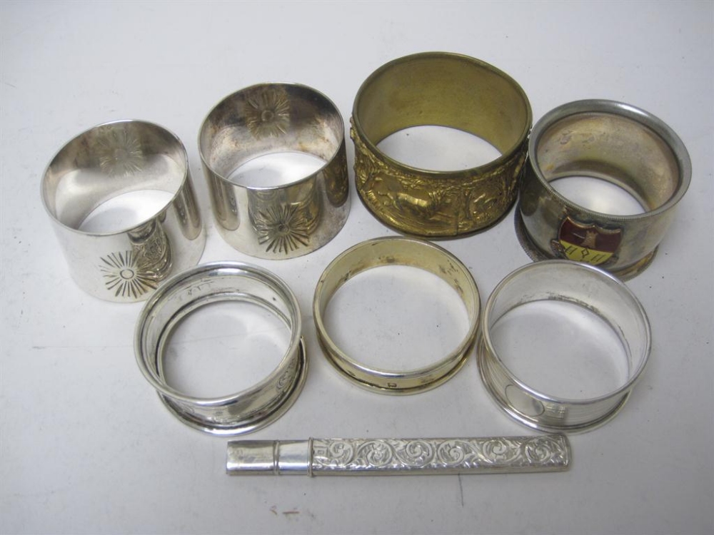 An Edward VII silver cased Fruit Knife, Birmingham 1907, two silver Napkin Rings, a Continental