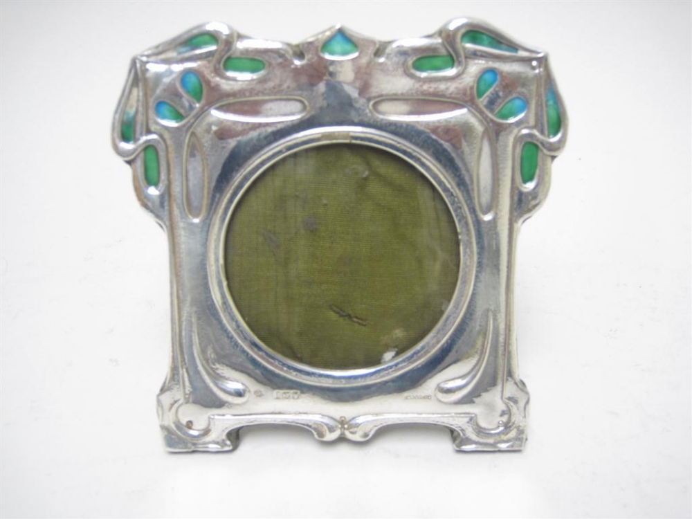 An Edward VII Art Nouveau silver and turquoise enamel Photograph Frame, London 1904, 5 1/2 x 5in,