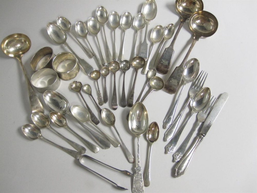 A quantity of silver and plated Coffee Spoons, plated Ladles, silver Mustard Spoons,Napkin rings