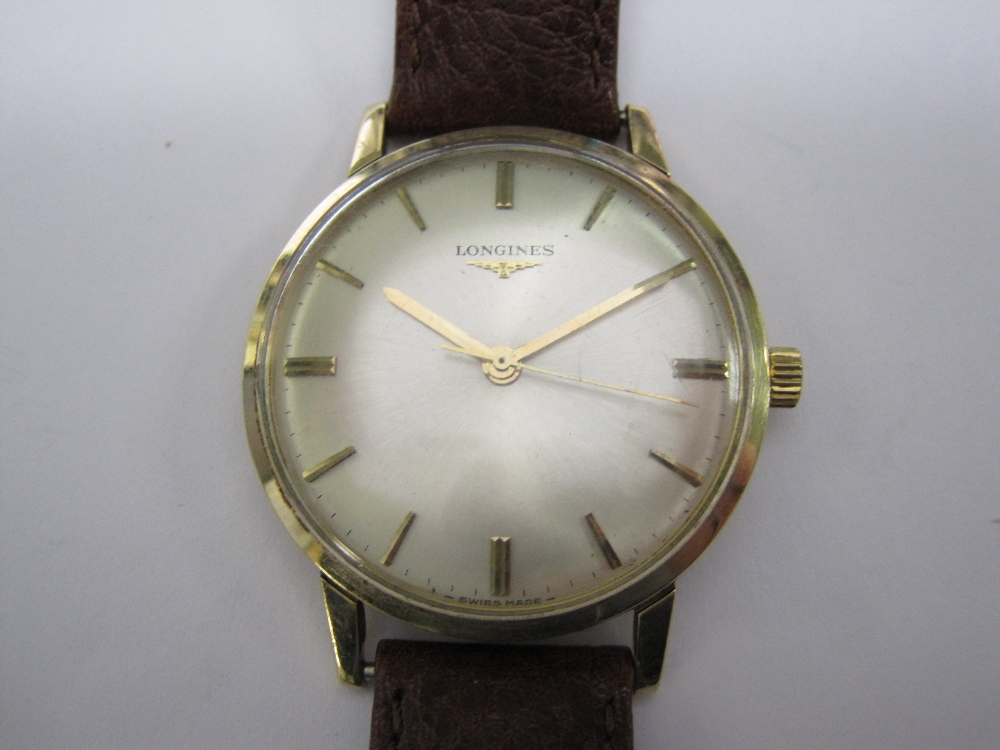 A Longines Gentleman`s Manual Wristwatch the champagne dial with applied gold baton markers and
