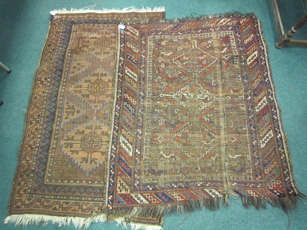 A bordered Belouch Rug and a Caucasian Rug, worn
