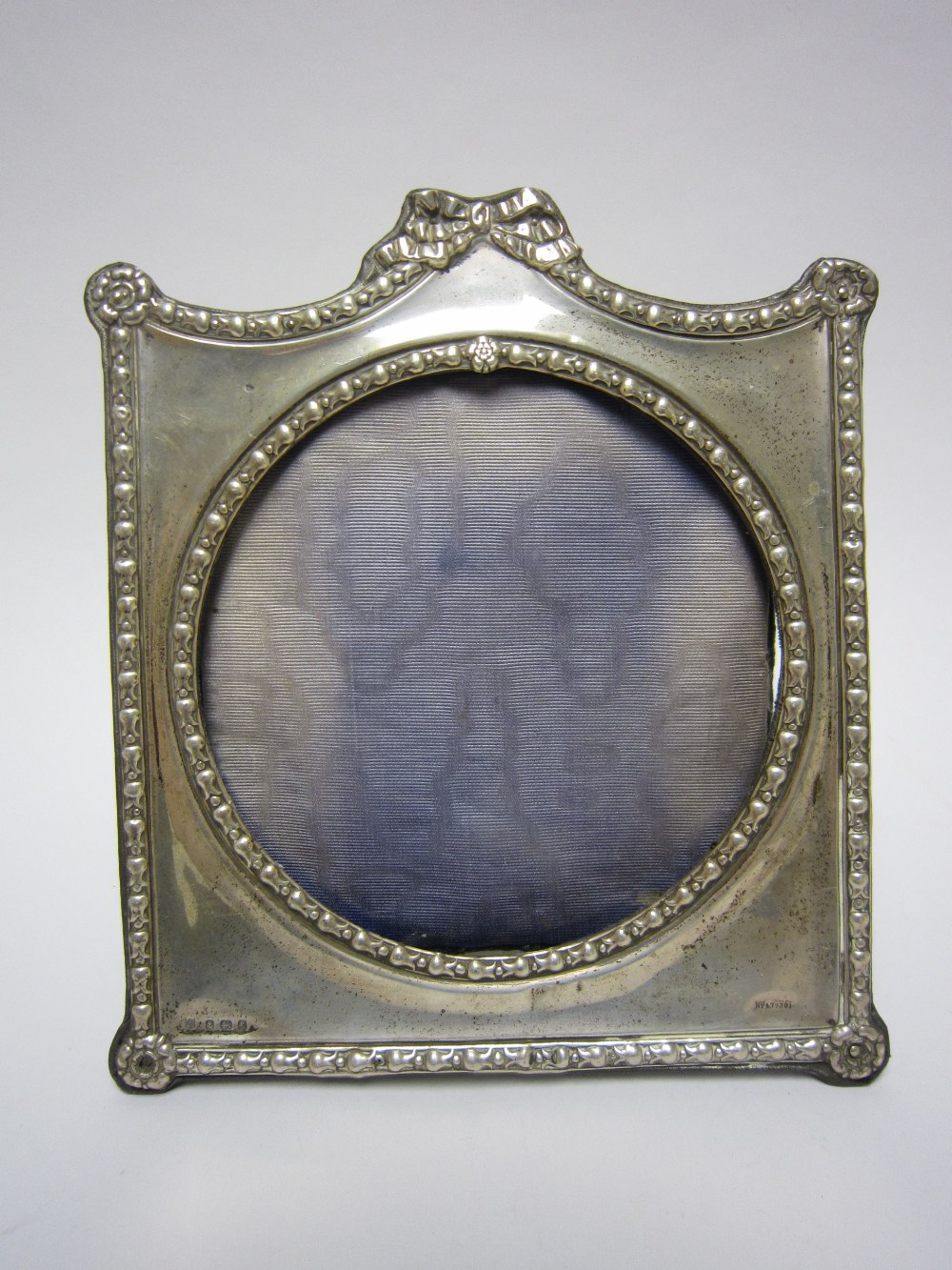 An Edward VII silver Photograph Frame with ribbon surmount, 8 1/2in, Birmingham 1906