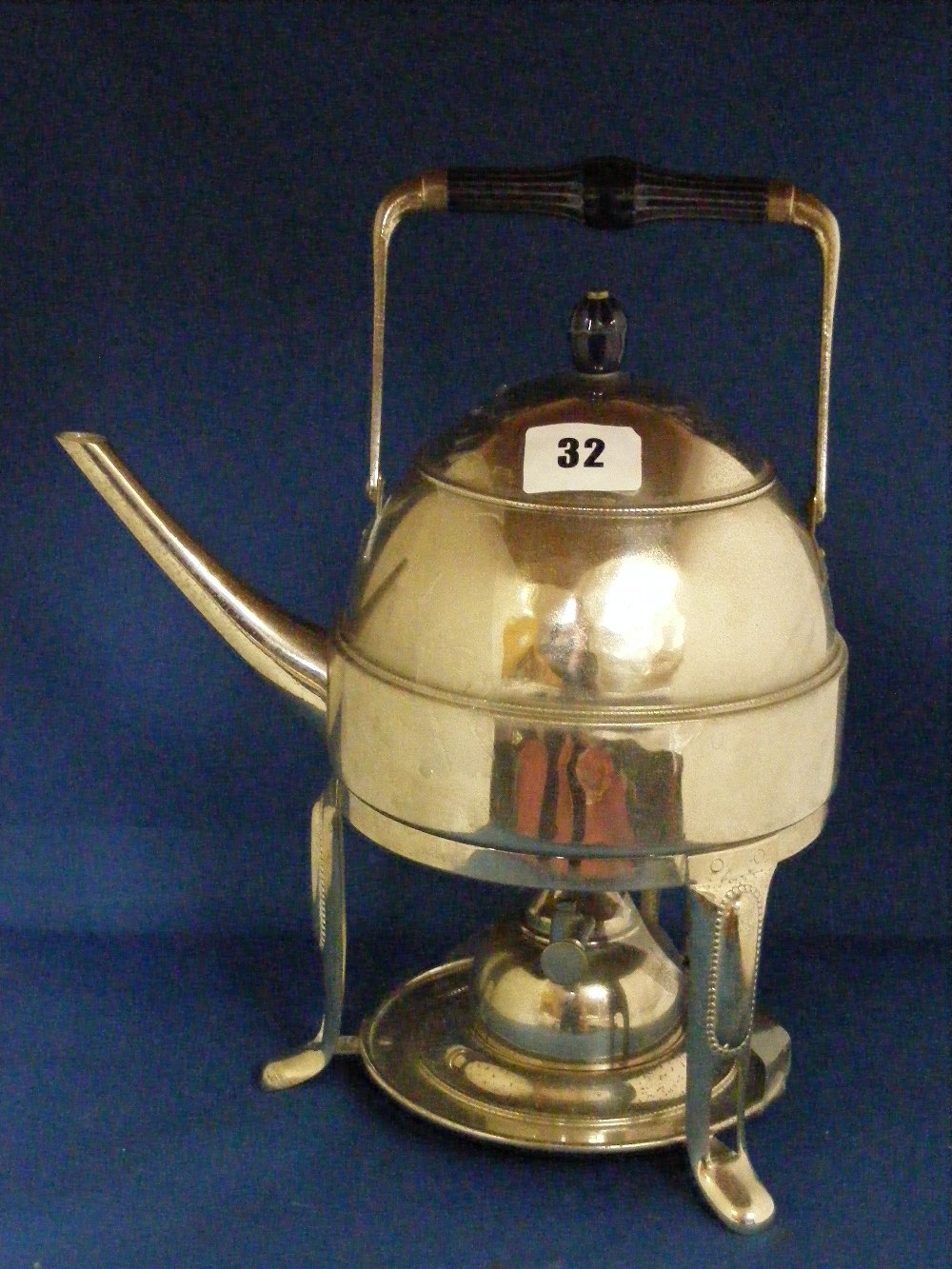 WMF, in the manner of Peter Behrens, c1910.    A silvered-metal Secessionist kettle on stand with