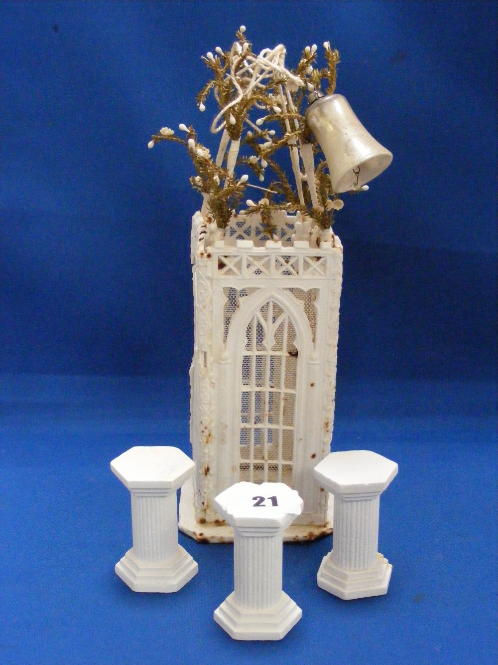 A Victorian wedding cake decoration made in icing sugar and depicting a gazebo.