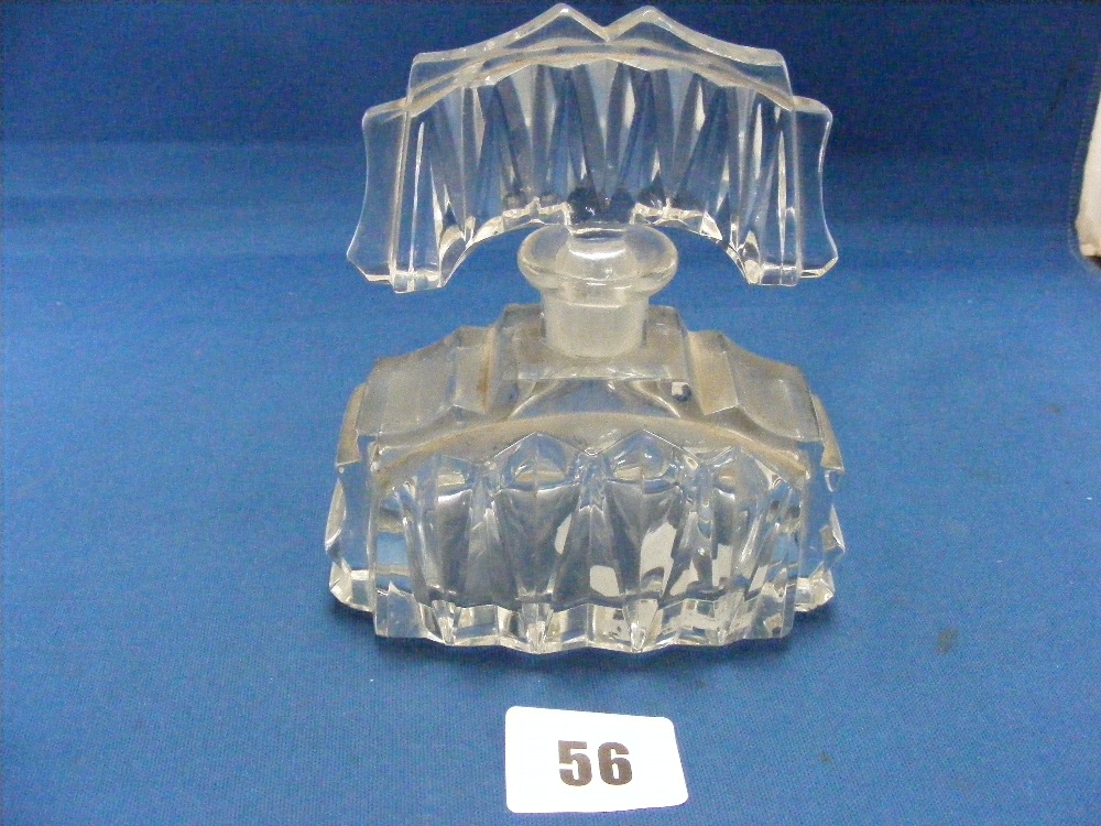 A stylish cut glass Art Deco perfume bottle, c1930, with elaborate original stopper. Height: 5