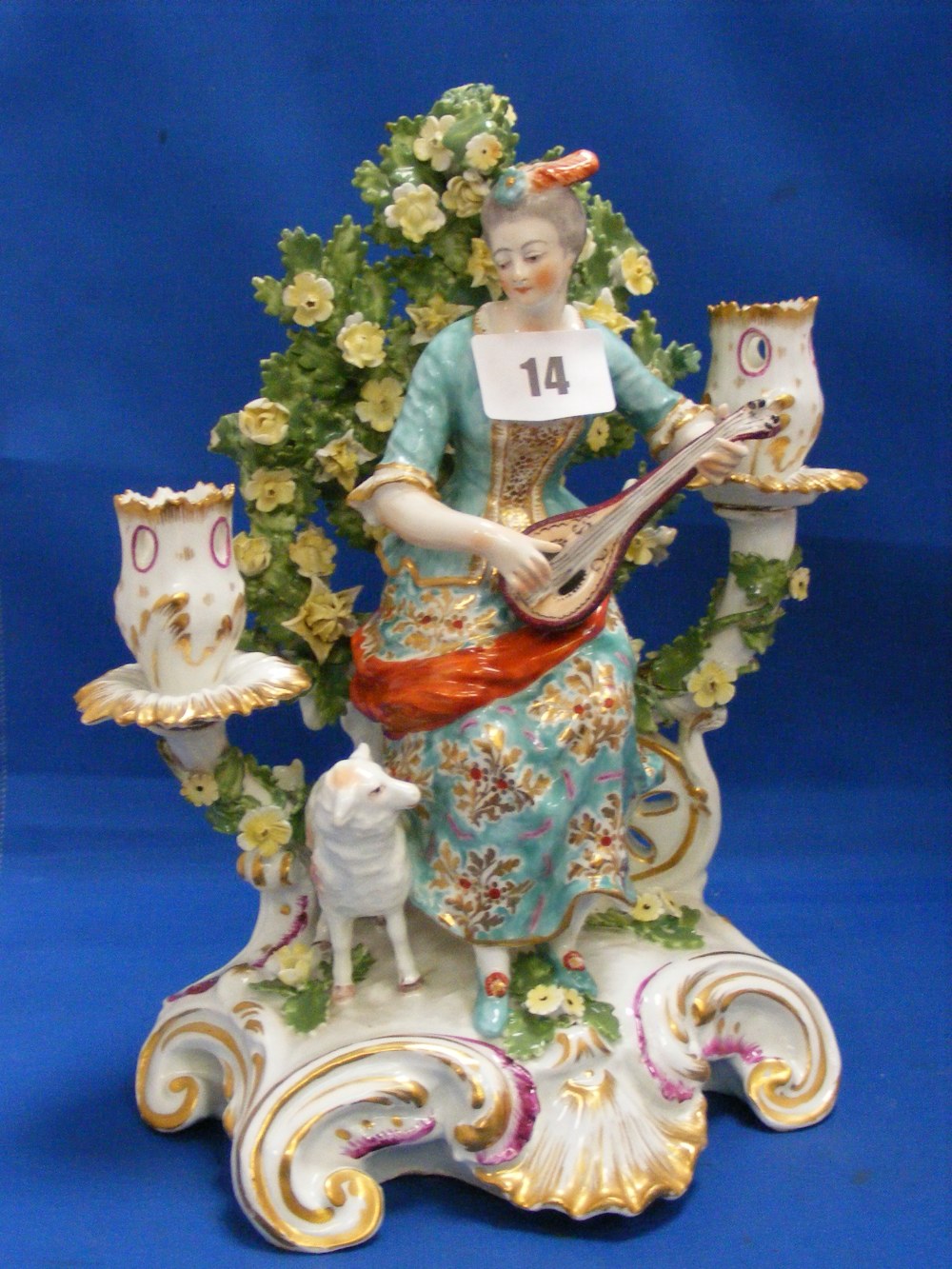 An early Victorian Chelsea Porcelain 2-branch candelabra, depicting a lady playing a lute with a