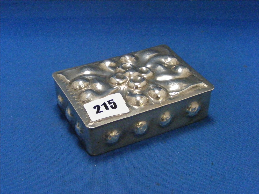 An Arts and Crafts polished pewter box and lid, marked A E Chanal to base.