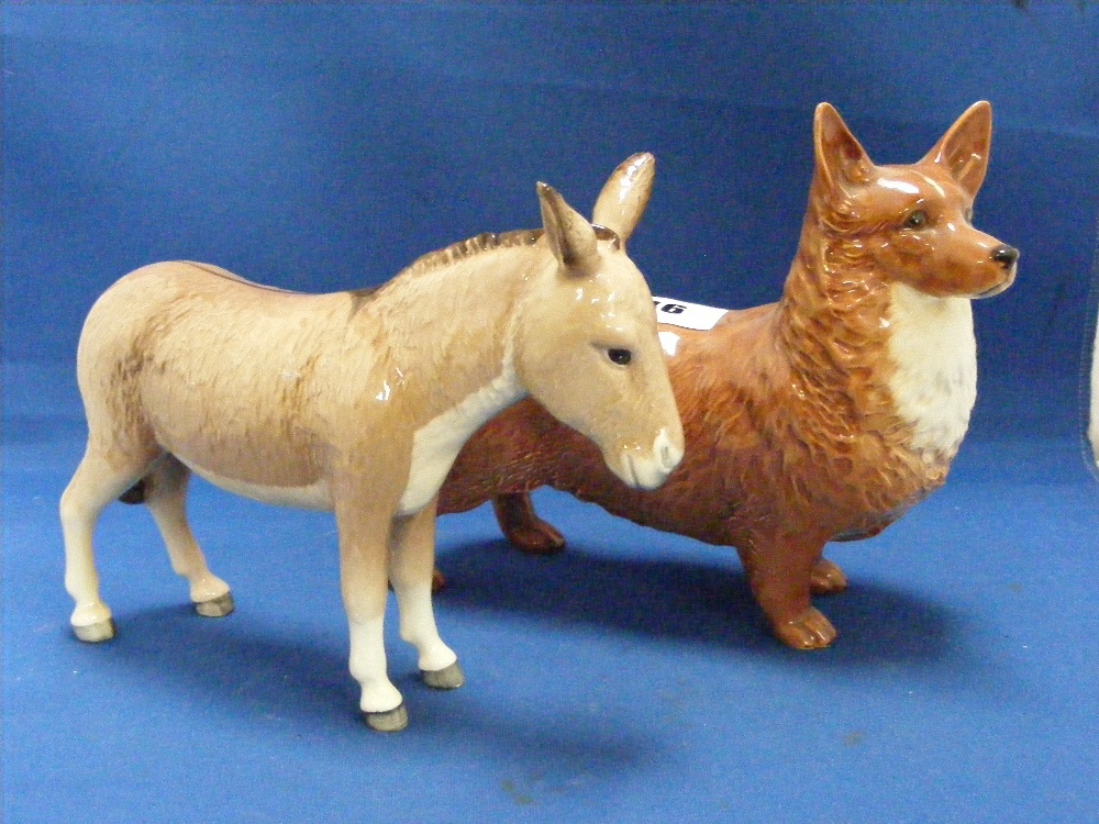 A Beswick figure of a donkey foal with original paper label to base, together with a Beswick