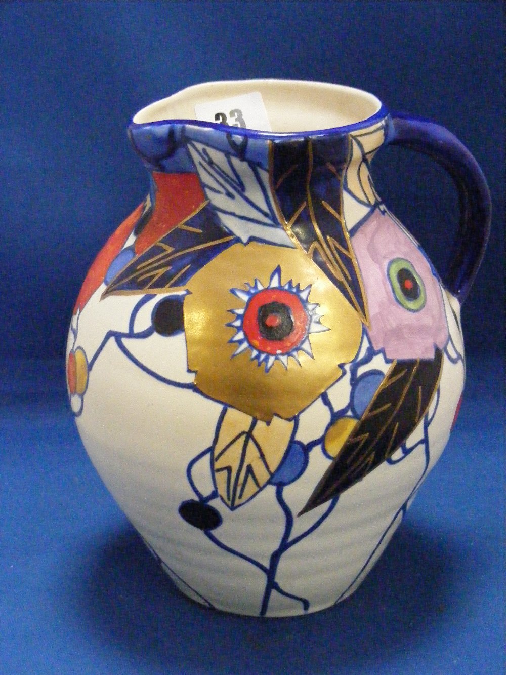 A highly decorative 1920's/30's Bursley ware jug designed by Charlotte Rhead, decorated with