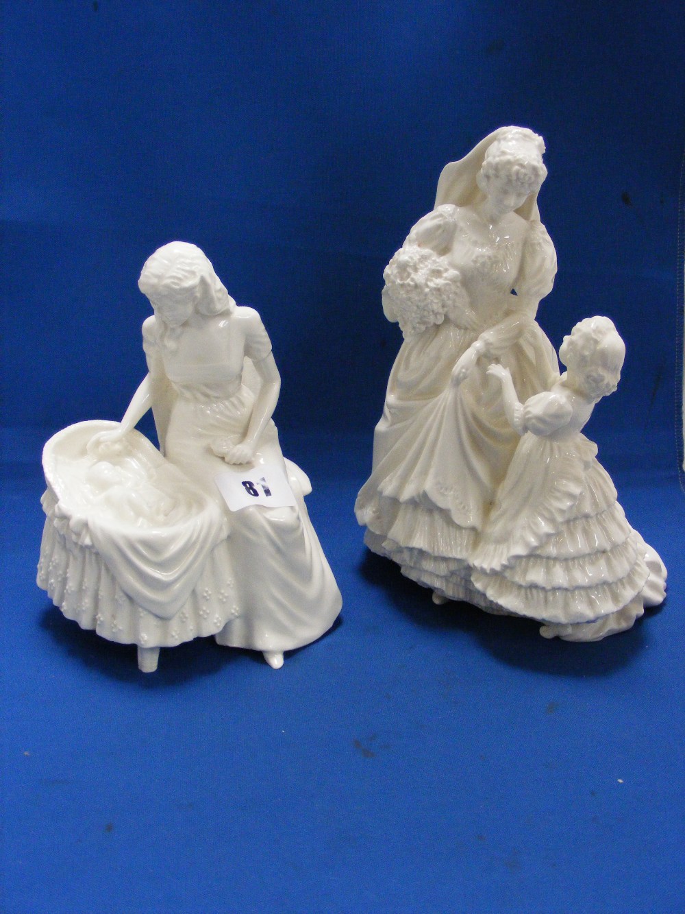 Two Royal Worcester Compton and Woodhouse figurines, one entitled 'Mother's Love', the other