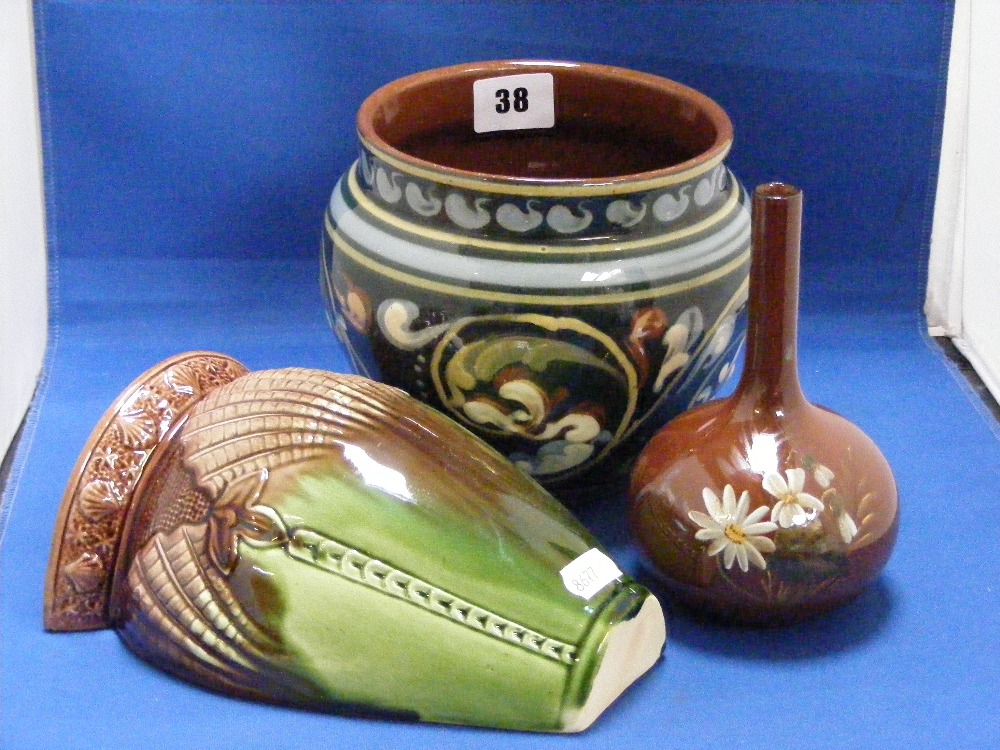 Three West Country Pottery items, to include a Watcombe wall pocket in green and brown, a Watcombe