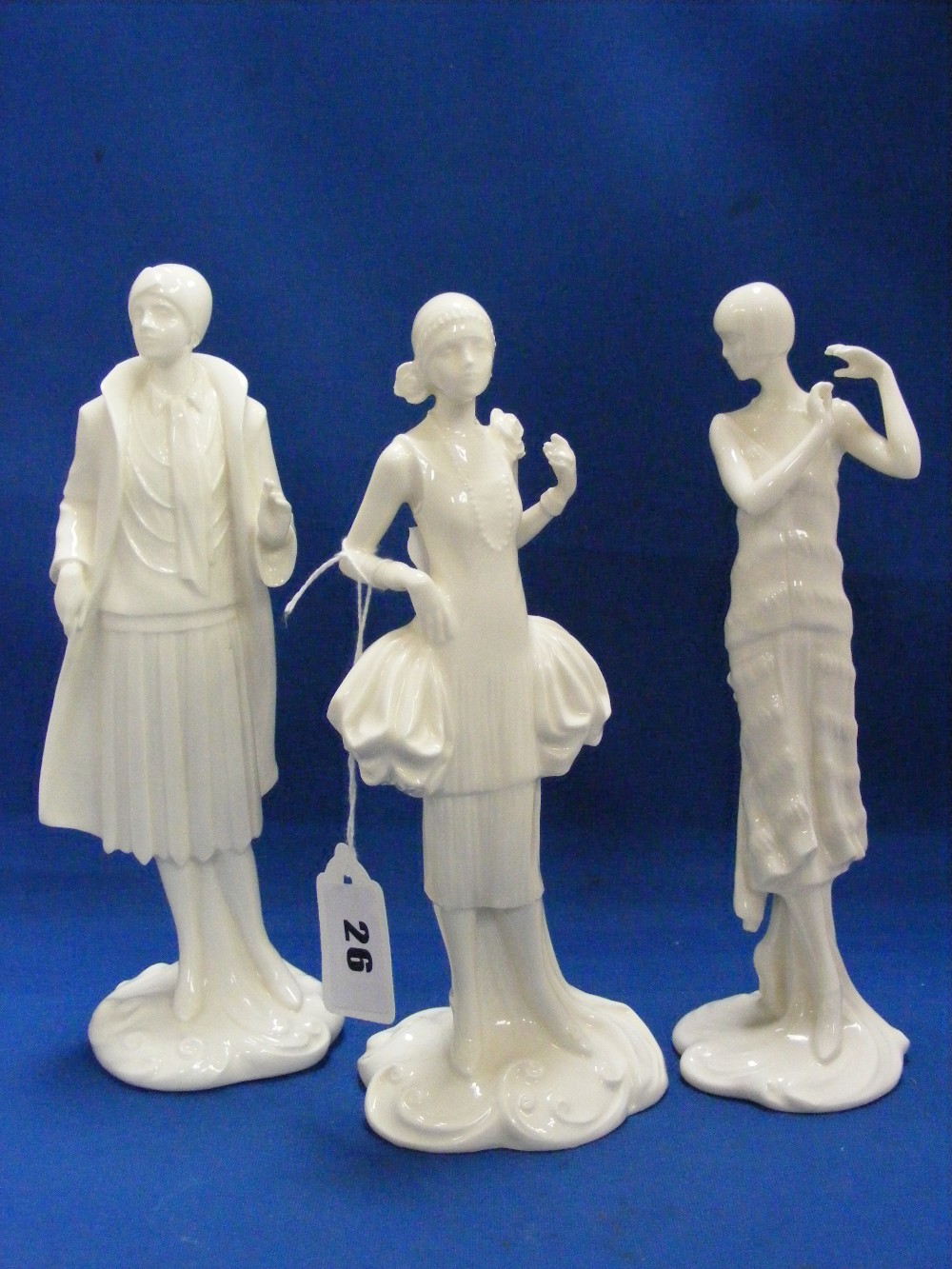 Three Royal Worcester Compton and Woodhouse blanc-de-chine figurines from the 1920's Vogue