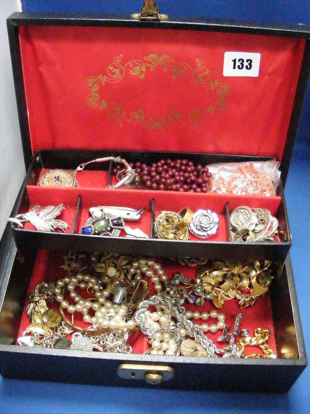 A jewellery box with costume jewellery.