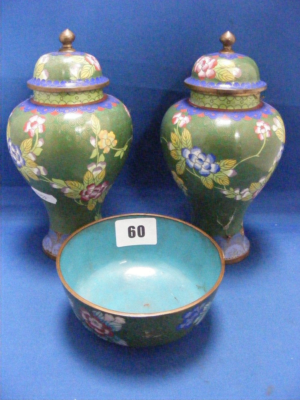 A fine pre 1939 Japanese cloisonné garniture comprising twin lidded vases, 18cms high and central