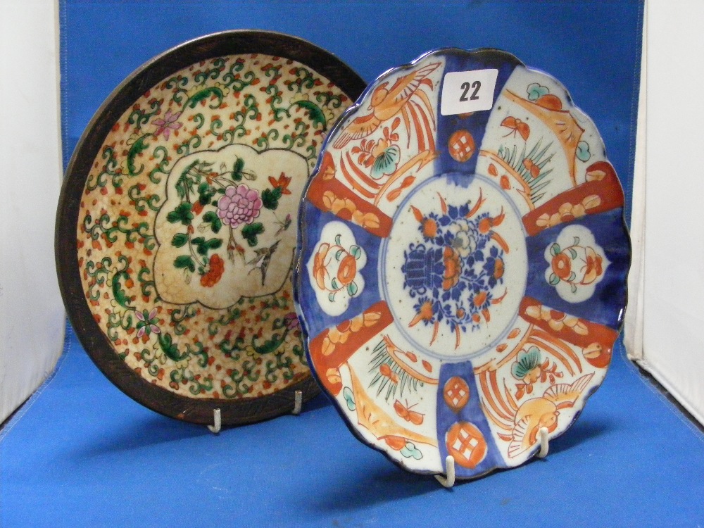 An Oriental dish, scalloped form, together with one other Oriental dish with hand painted