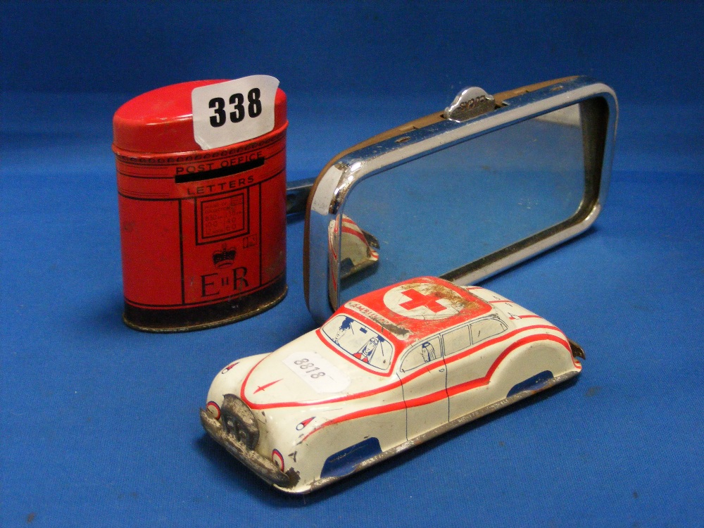 A vintage Lucas rear view mirror, together with a tin plate toy ambulance car and a tin plate