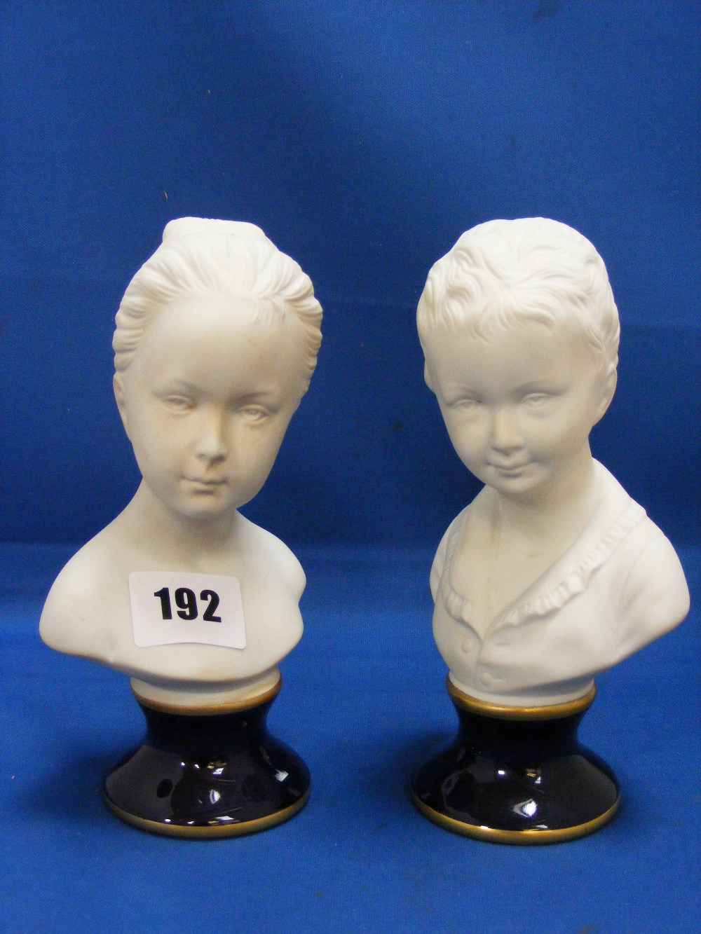 A fine pair of German Unter Weiss Bach porcelain and bisque busts each depicting a young lady on