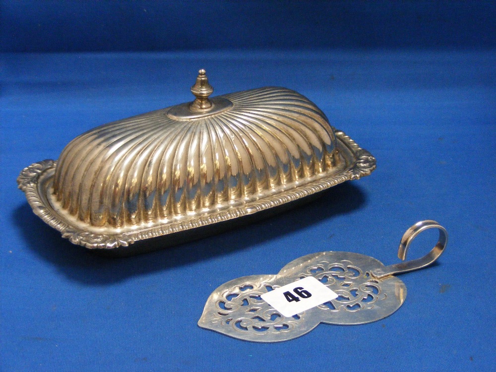 A fine antique silver plated butter spade with pierced intricate decoration and a silver plated