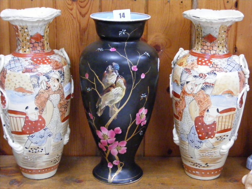 A pair of Satsuma ware vases depicting typical Oriental scenes, together with a vase depicting two