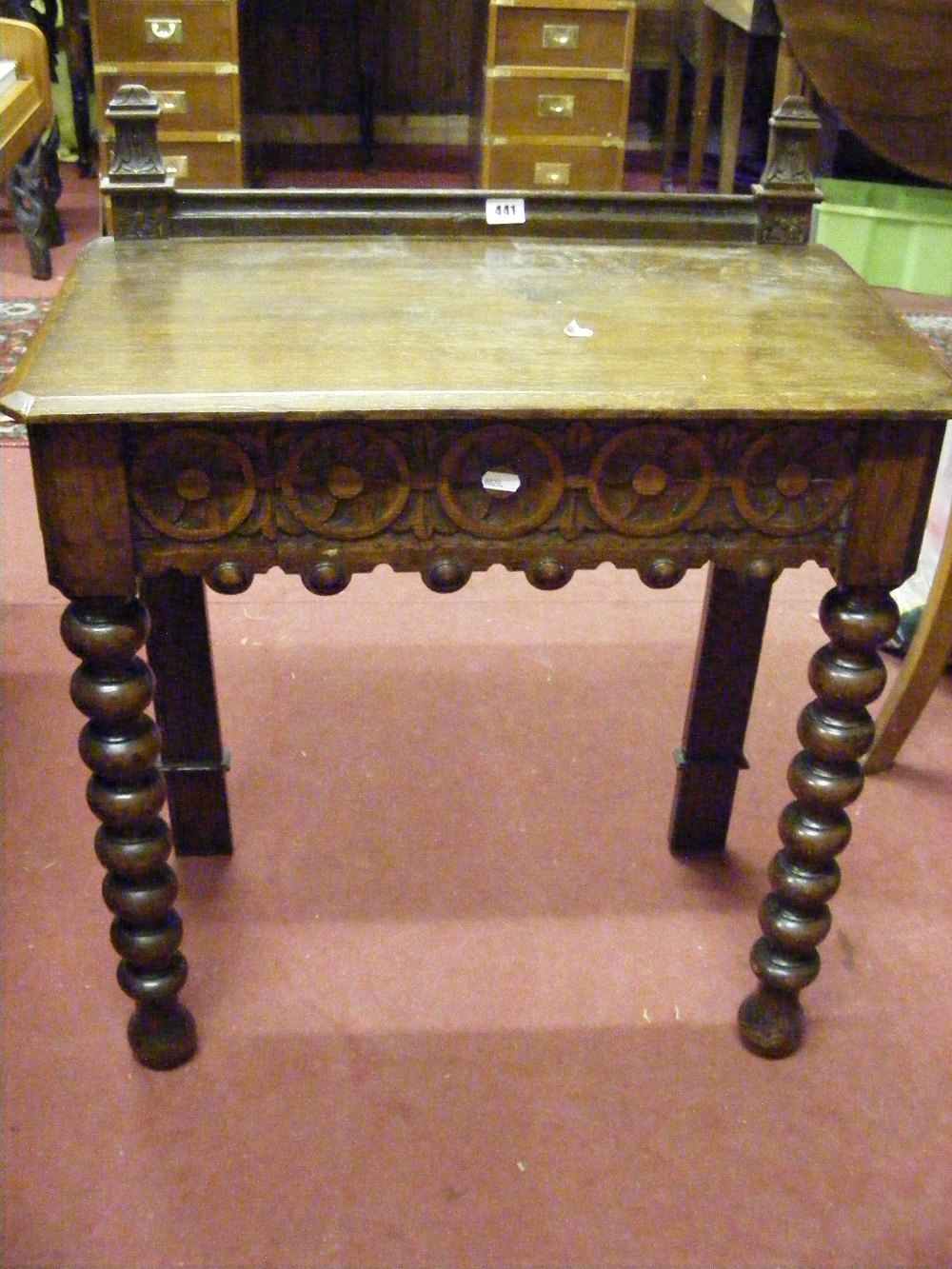 WITHDRAWN  A fine quality antique oak side table with bobbin turned supports, with carved drawer and