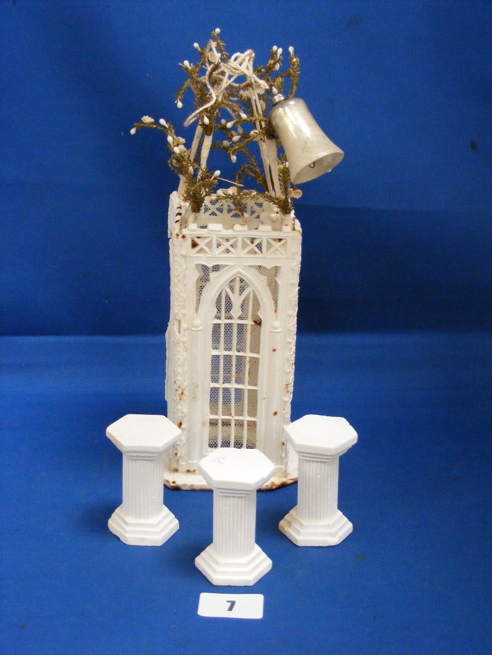 A Victorian cake decoration made in icing sugar and depicting a gazebo.
