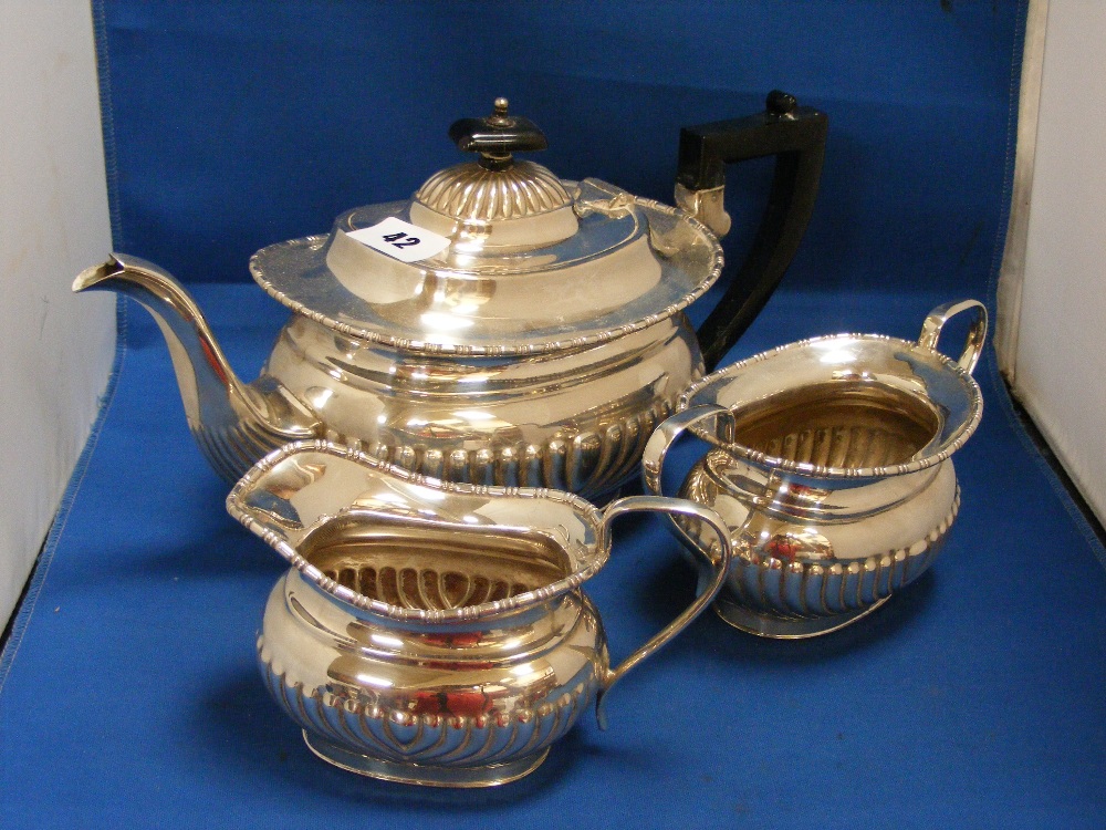 A circa 1930's 3-piece silver-plated tea set by Sheldon, comprising teapot, two handled sugar bowl