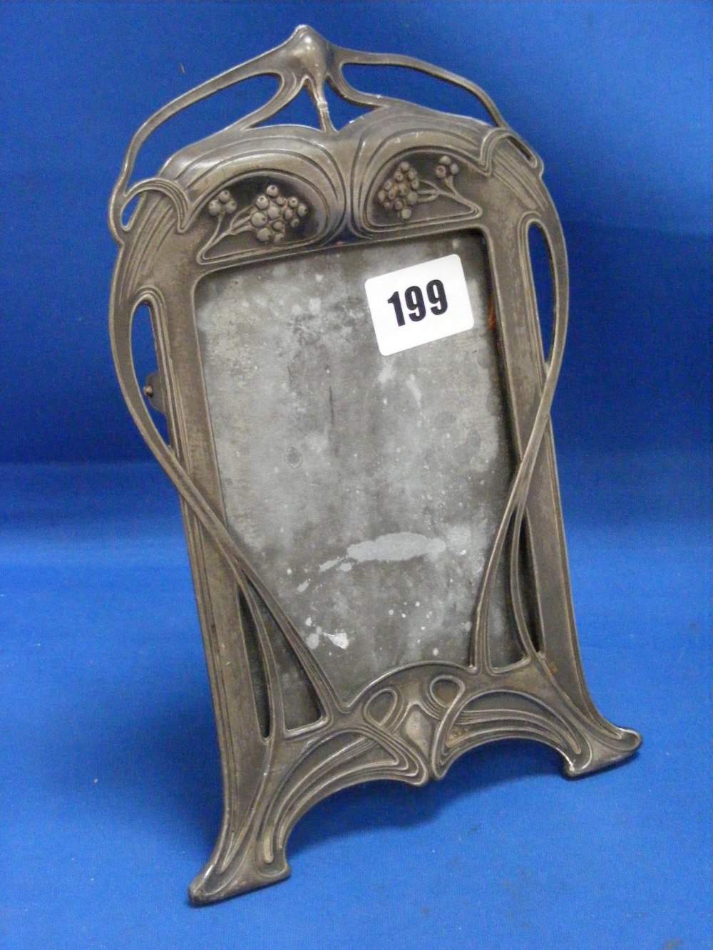 WMF, c1904.    An Art Nouveau pewter picture frame of typical sinuous form. With original back and