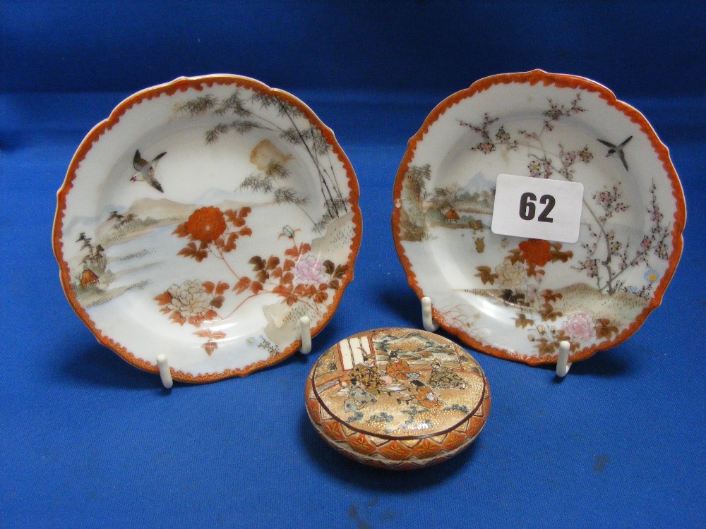 A pair of Oriental pin trays with hand painted on transfer decoration depicting typical Oriental