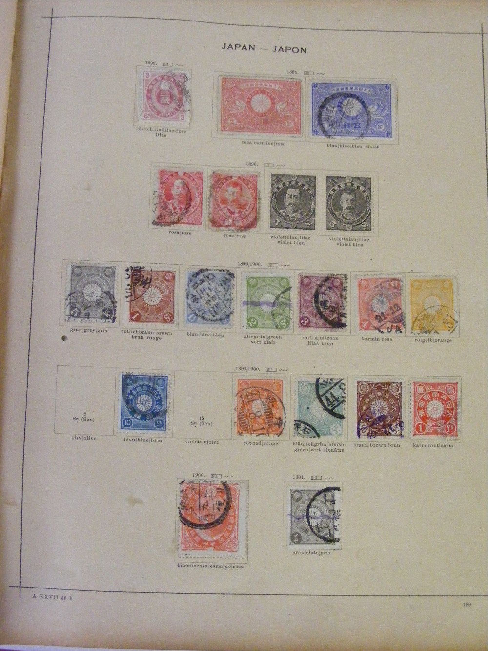 An early 20th Century postage stamp album of stamps from around the world, with some stamps