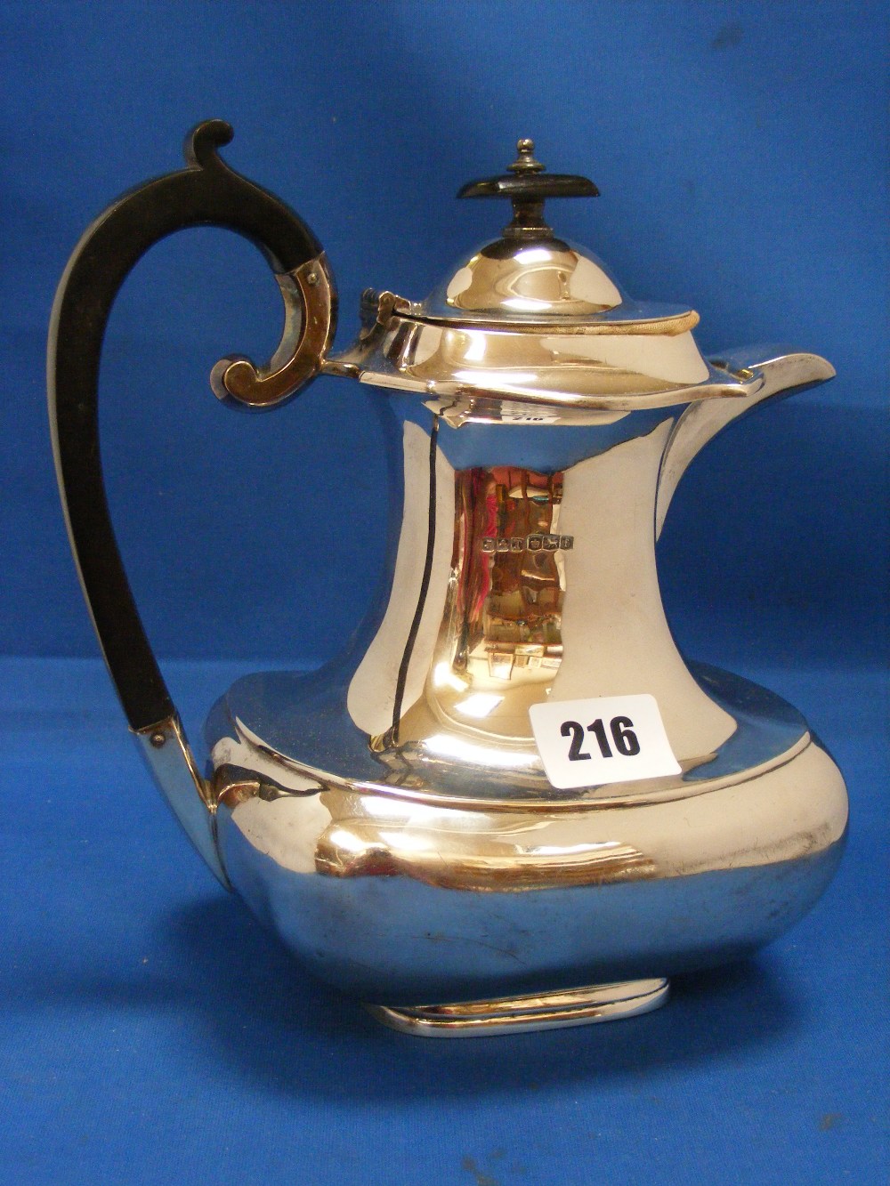 A nice quality silver coffee pot of bulbous and waisted form, H/M Sheffield 1923.