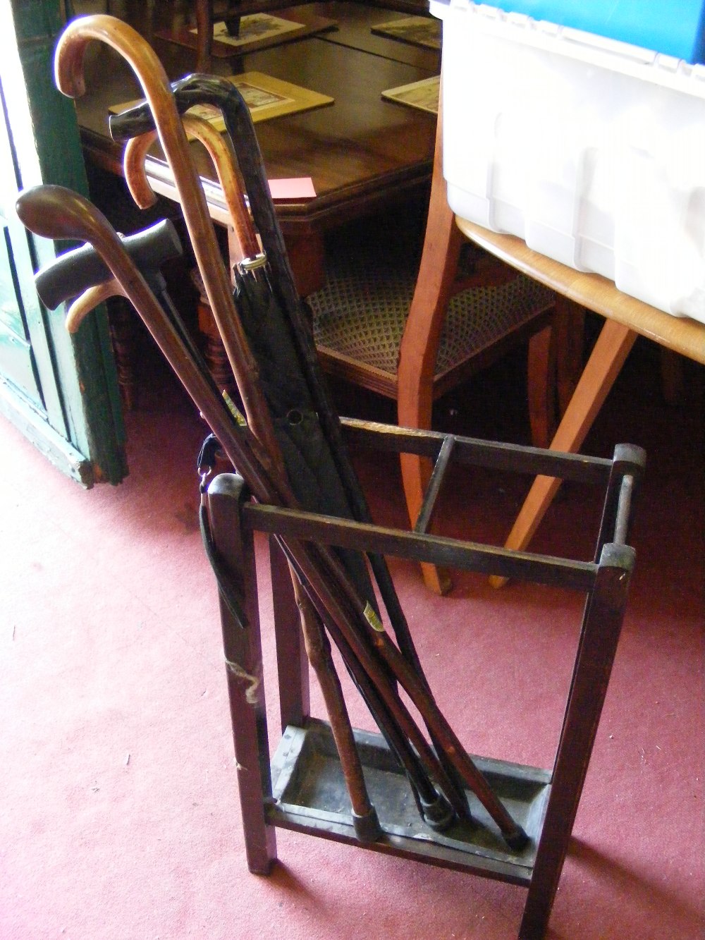 An Edwardian stick stand and sticks.