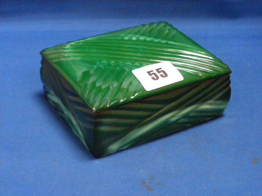 A 1930's marbled green glass dressing table box with lid.