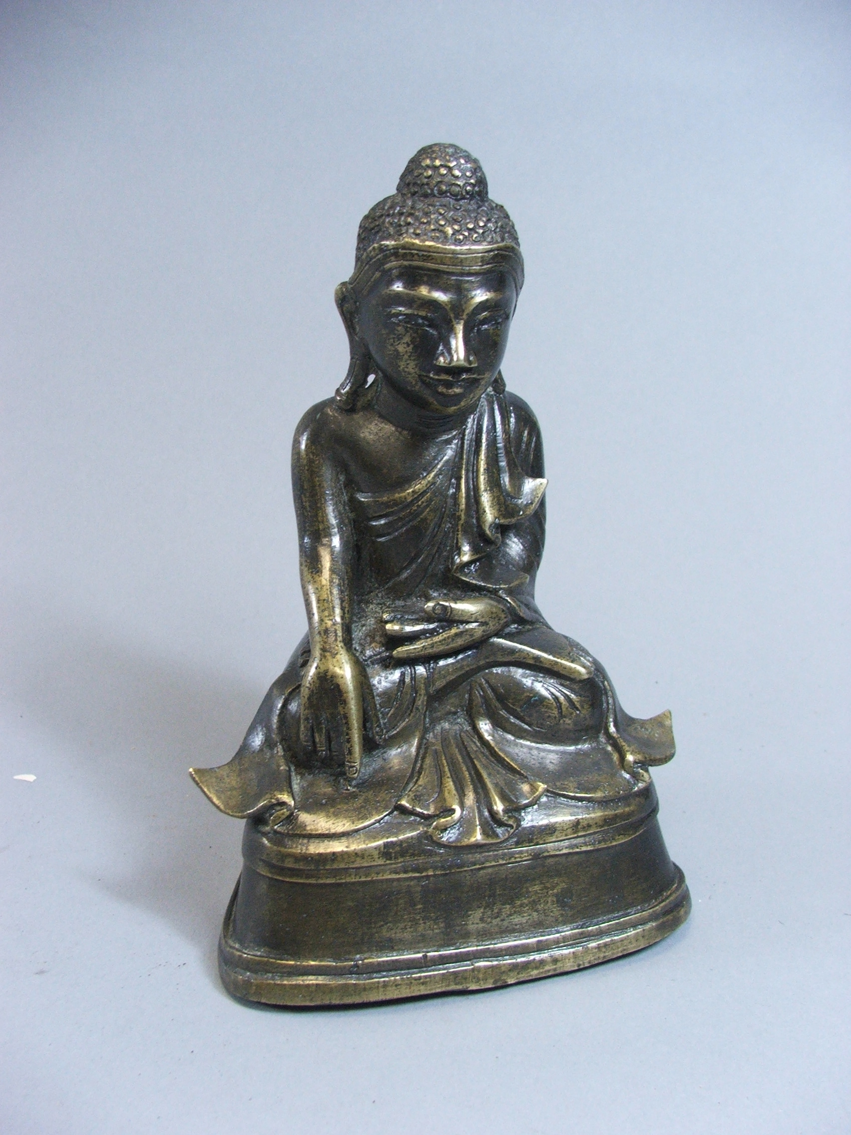 A Late 19th Century Indian Bronze Buddhavista Seated in Varada Mudra Pose, 15 cm High.