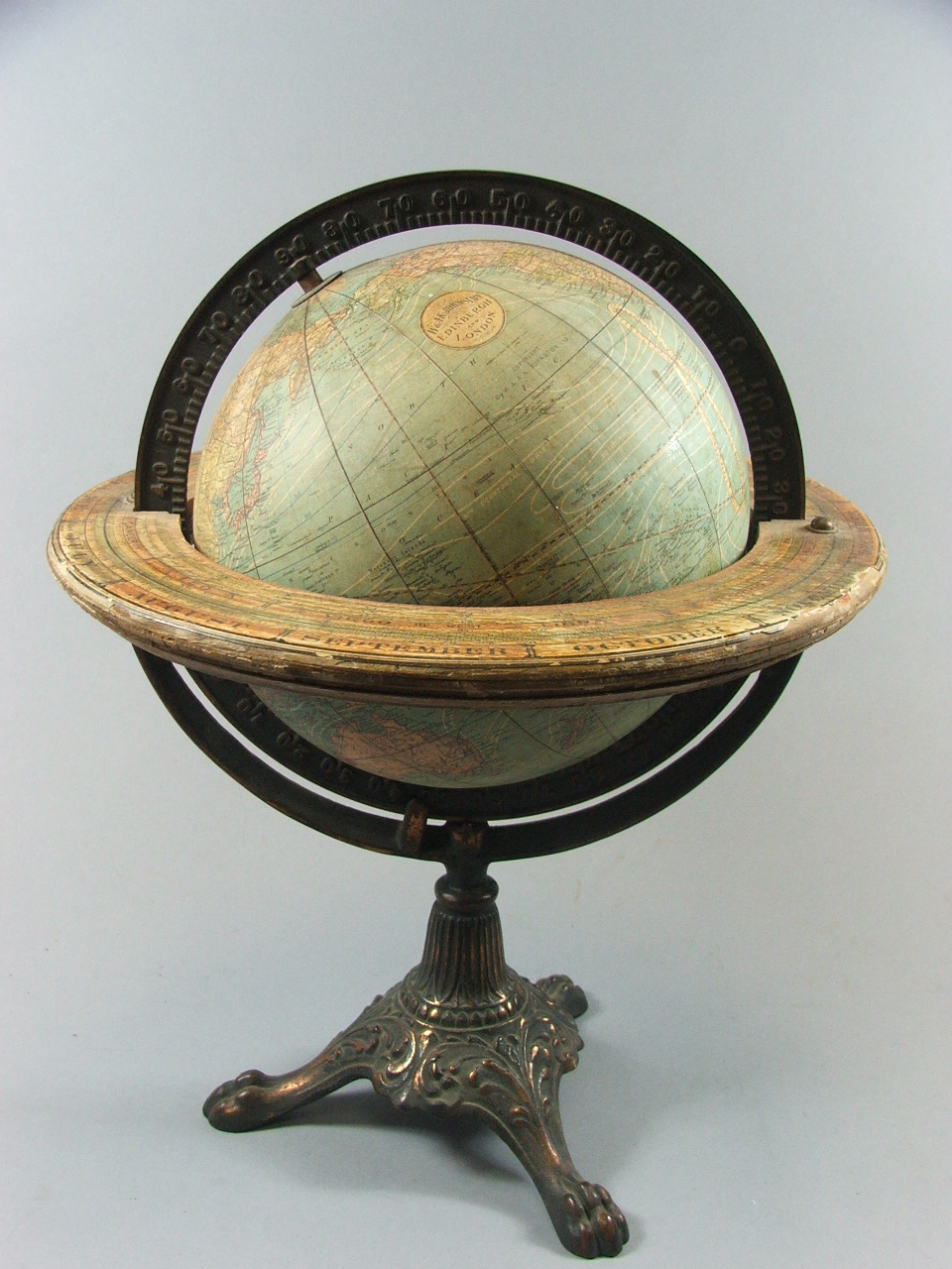 An 8" Library Table Globe by W & A K Johnston of Edinburgh and London with Cast Meridian and Paper