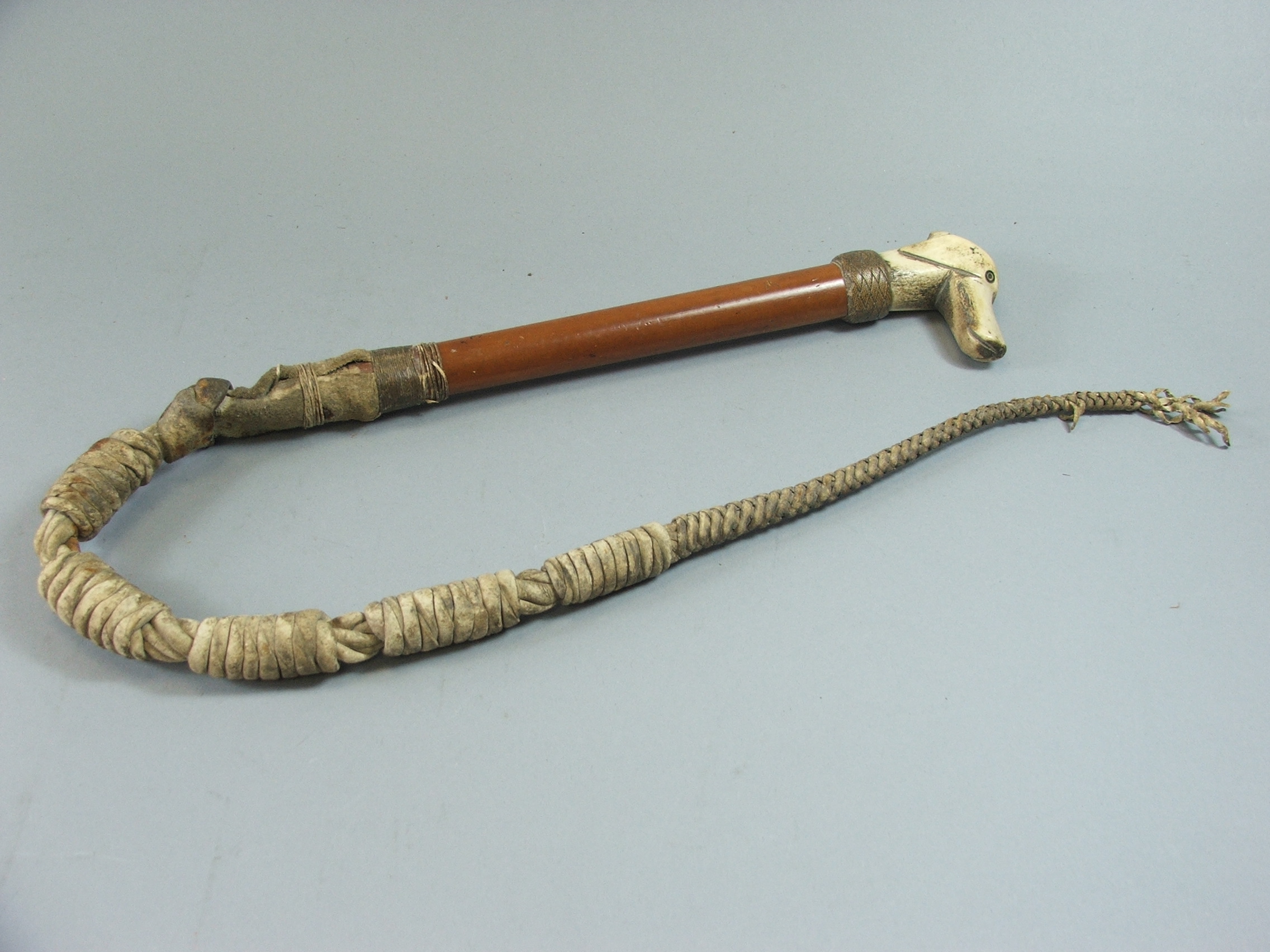 A Late 19th Century Carved Bone Handled Whistle Hunting Crop, the Handle in the form of a Hounds